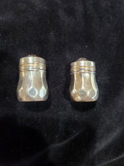 Sterling Silver Salt and Pepper shakers.