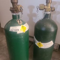 2 Small Oxygen Cylinders 