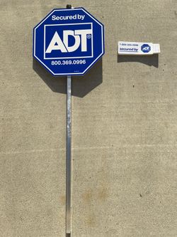 ADT or Brinks sign and stickers