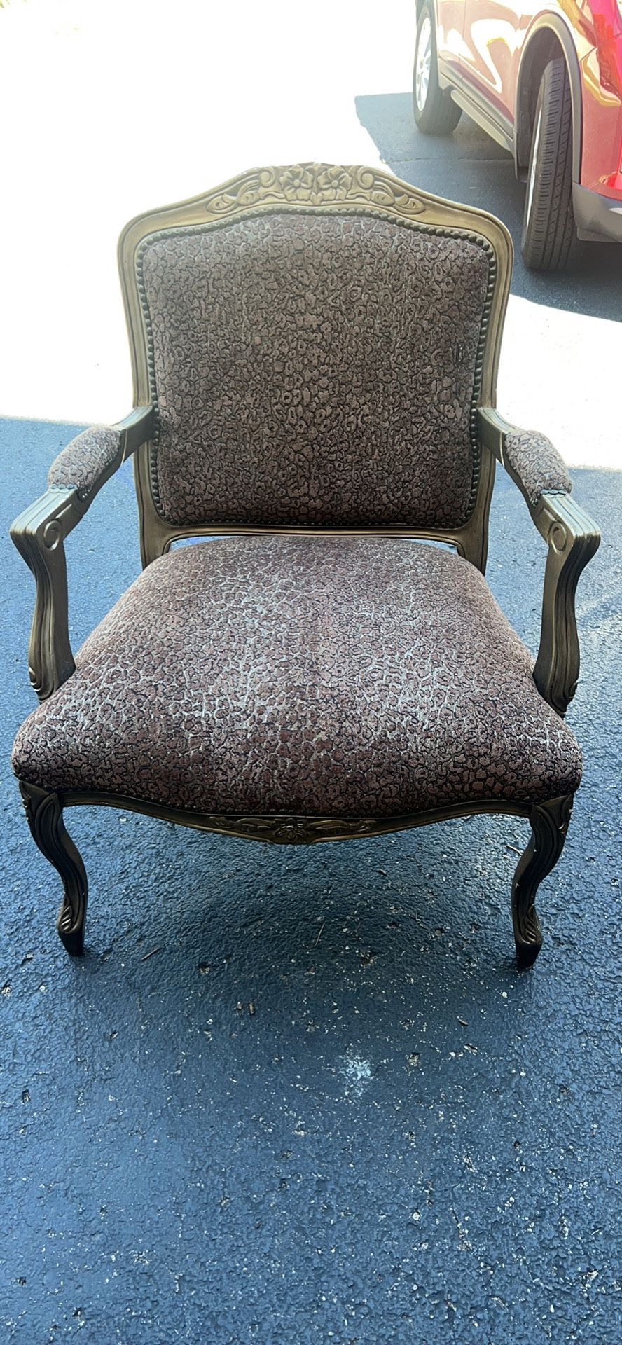 large oversized upholstered leopard print chair . Has sone scratches from use - see pics