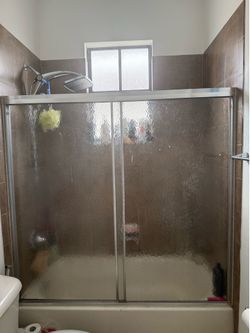 Sliding bathroom shower door