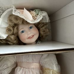 Antique Porcelain Doll. In The original box with papers.