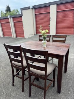 Wooden high table and four chairs