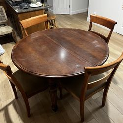 Solid Wood Canadian Made Dining Table with leaf and 4 Very comfortable Chairs