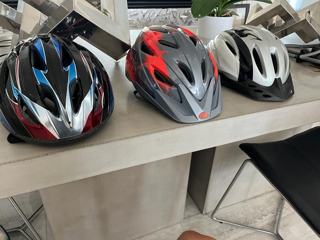 Three bike helmets. One Bell, one  Banter  