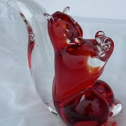 Red and clear squirrel glass paperweight.