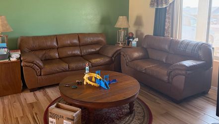 Brown leather couch and loveseat set