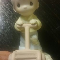Precious Moments " Mow Power to Ya" figurine.