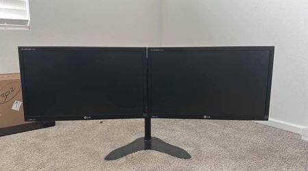 $115 - (2) 23” LG Monitors with dual monitor stand (see description regarding port options)