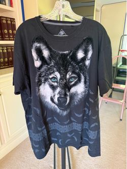 Graphic tee displaying a large wolf head portrait