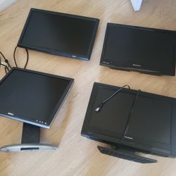 four flat screen monitors including 2 TVs