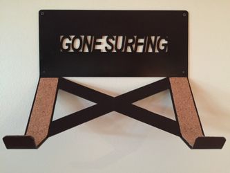 Surfboard wall rack