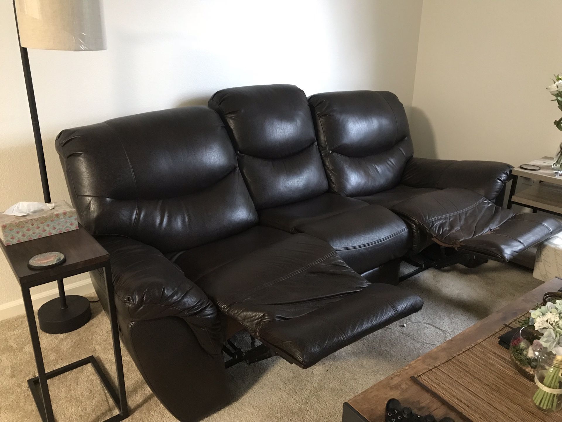 Free vinyl couch - torn at one foot rest but reclining works perfectly