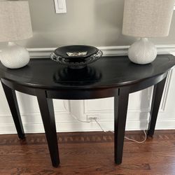 Black round console table
