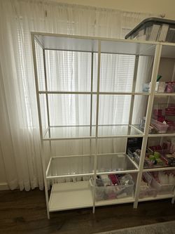 White steel shelves with glass