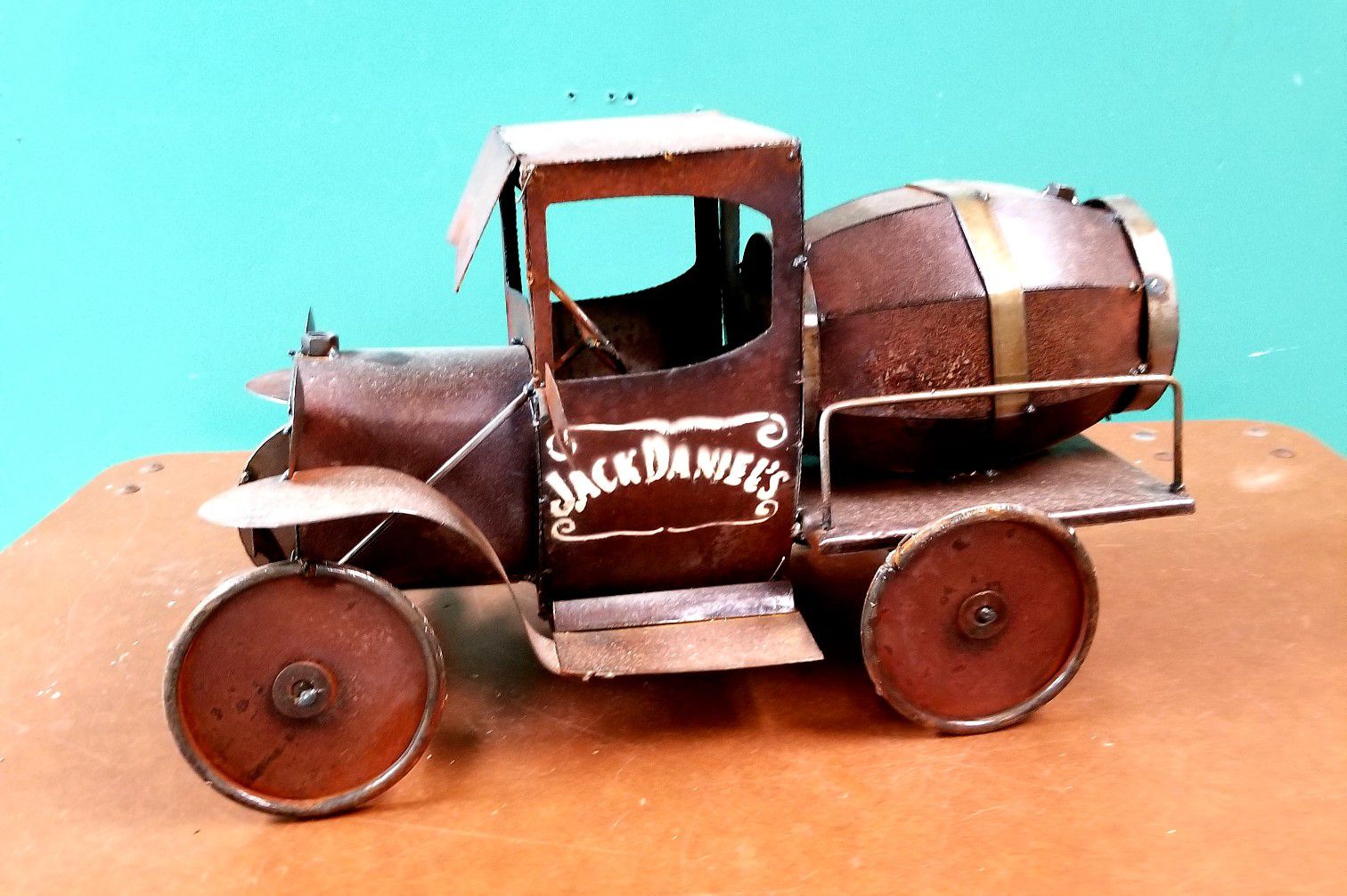 Handmade metal cars and trucks at rooster's