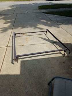 Brown metal bed frame/ fits twin or full size