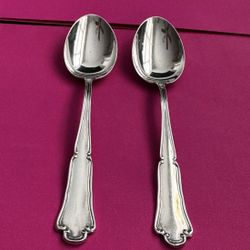 Pair of sterling silver tea spoons marked 800  Approx 4 inches each  In great condition