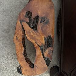 Small table made out of wood. It’s one piece.