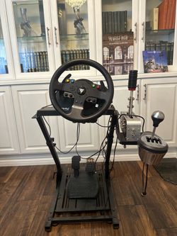 OBO Thustmaster steering wheel, pedals,e brake, and manual shifter