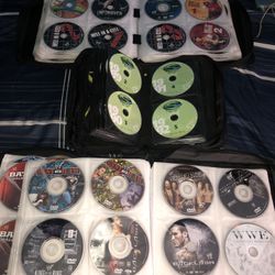 245 WWE AND TNA WCW WWF DVDS and video games collection