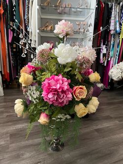 Faux floral arrangement with vase