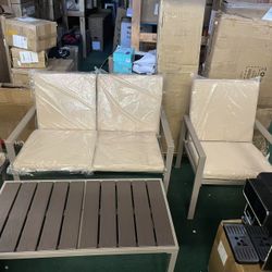 Beige four-piece outdoor patio furniture set