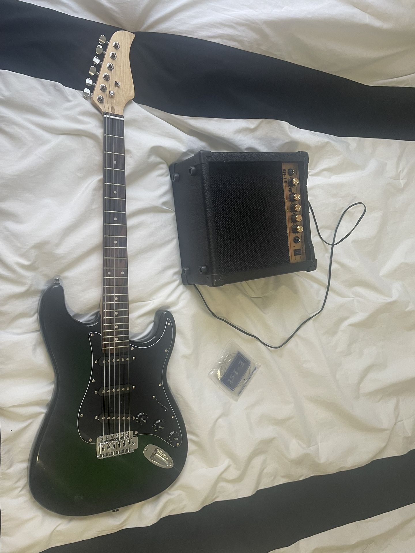 beginner guitar and amp with new strings