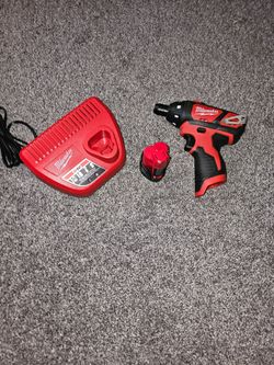Milwuakee m12 screw driver with charger and 1 battery.