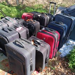 LOTS OF NICE PULL ALONG LUGGAGE 