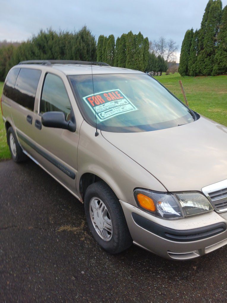 Tan  2003 Chevrolet Venture Minivan.