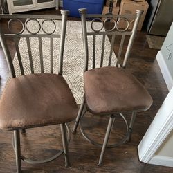 Two 27” High Brown Iron Swivel Bar Stools