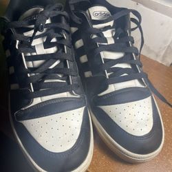 Adidas low-top sneakers (black/white with gum sole).