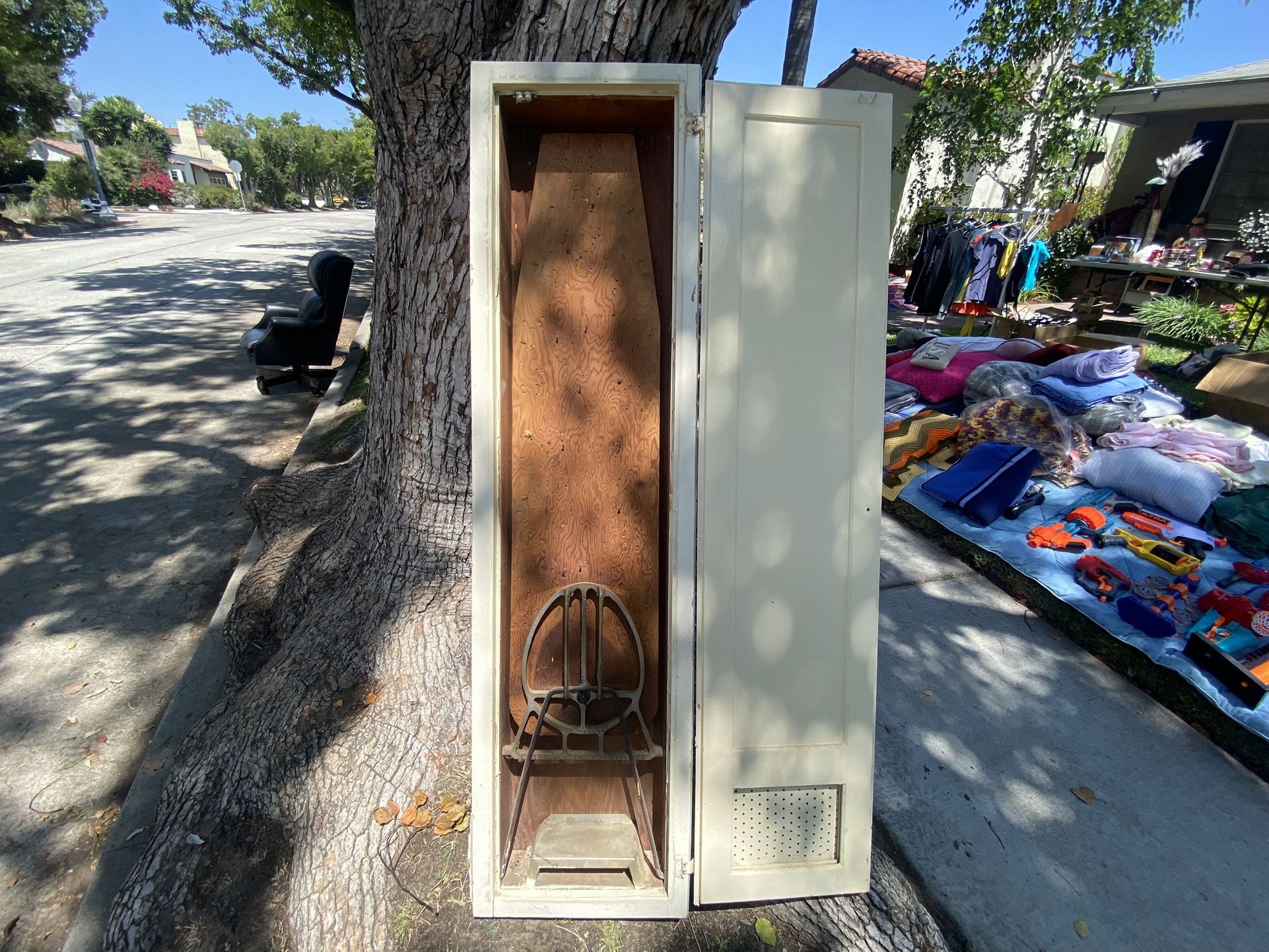 Vintage ironing board in closet/cupboard