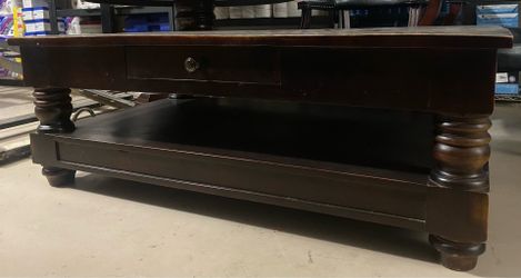 Solid wood coffee table-$50-higley and ray.