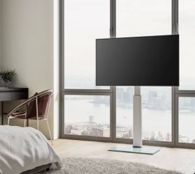 FITUEYES Floor TV Stand For TV's From 32-60 in TV's. Floor Stand with Swivel Mount, Max Holds 66lbs. White Glass Base. Retails $99.99
