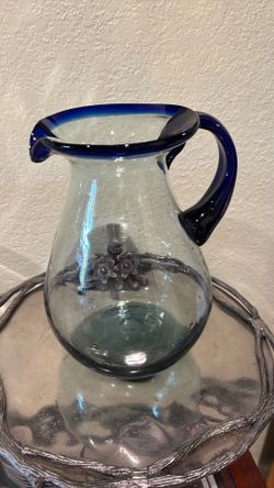 Vintage hand blown pitcher with cobalt blue handle and trim
