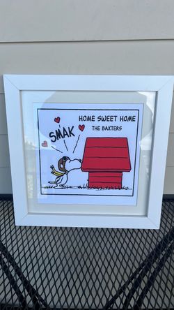 Home Sweet Home" Peanuts art print featuring Snoopy giving a kiss labeled "Smak" to his red doghouse