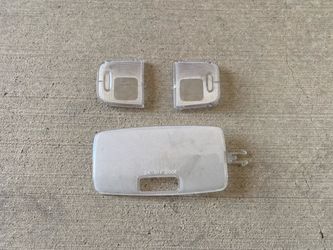 OEM interior light lens covers for a 2012–2015 Toyota Tacoma.