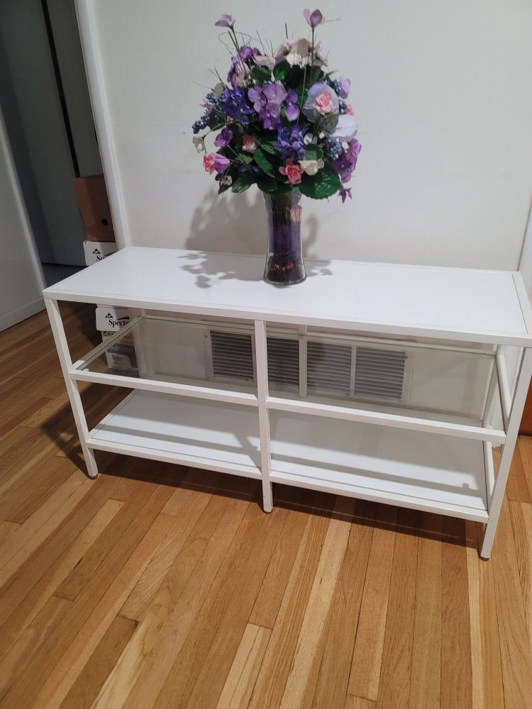 BOOK SHELF CLEAN WHITE GLASS MIDDLE SHELF IF YOU WANT THE FLOWERS WILL GIVE YOU FOR FREE WITH PURCHASE