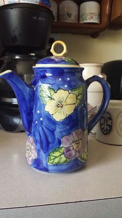 Ceramic teapot. Painted blue with yellow and pink flowers.
