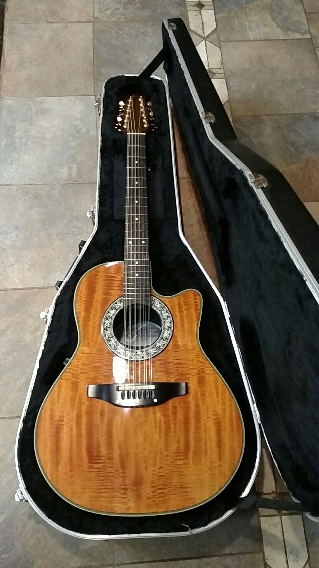 Ovation Pinnacle 385T 12 string guitar just adjusted and set up with new strings.