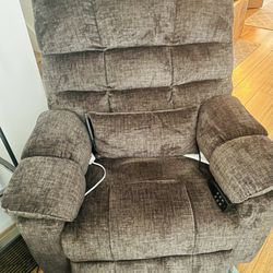 BRAND NEW! Comfortable grayish brown recliner chair in perfect condition.