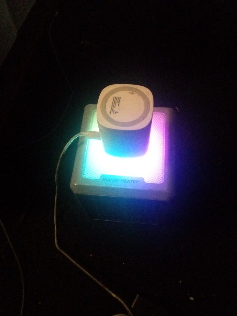 Wireless Charger For Phones, Earbuds And Smart Watches. With Multi Colored Flashing Base
