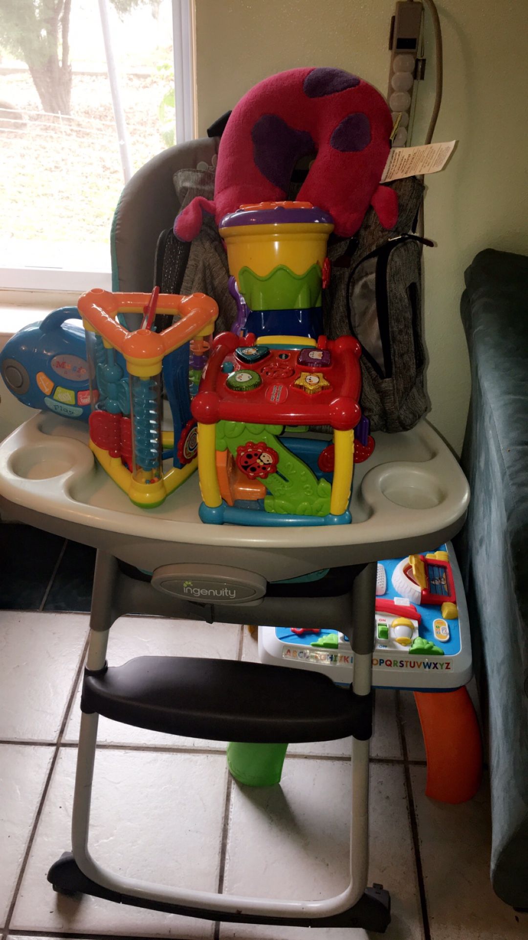 Baby stuff! High chair, toys and Eddie Bauber diaper bag
