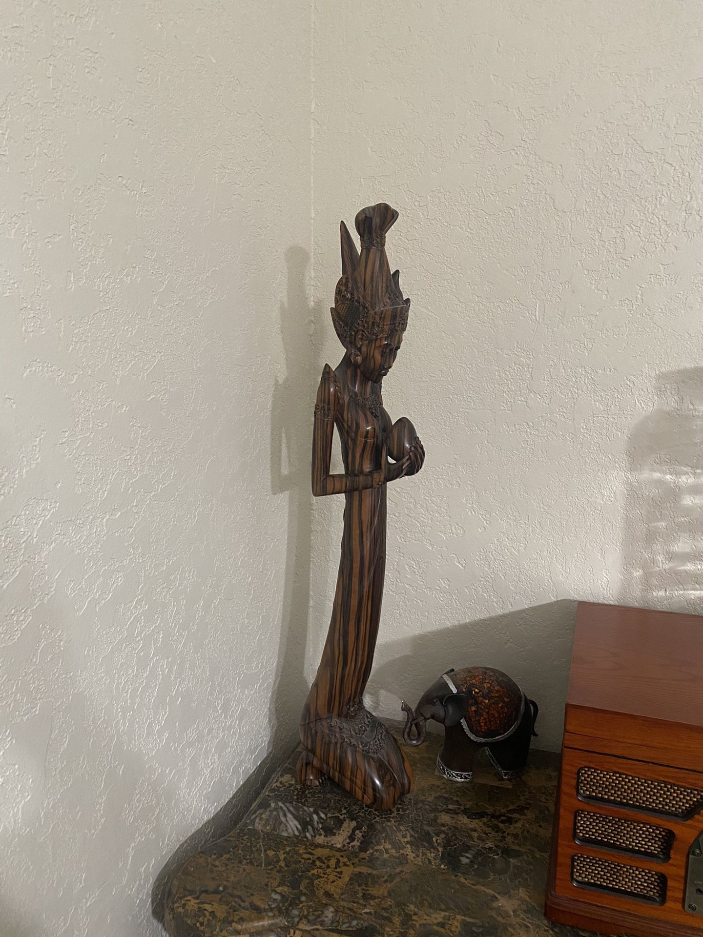29” hand carved wooden Statue holding an egg