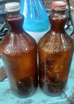 2 Vintage amber glass clorox bottles