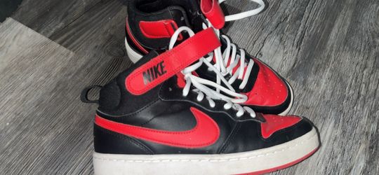 Red and black Nike shoes size 6