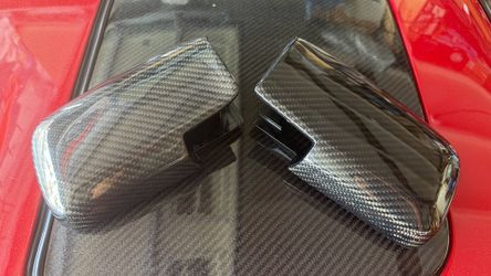 Set of OEM JDM Toyota AE86 mirror housing professionally overlayed in carbon fiber