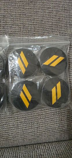 Genuine Mopar ceter caps, gloss or satin black with yellow dodge logo